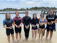 Students from Great Lakes College with tropical sea star Pentaceraster regulus