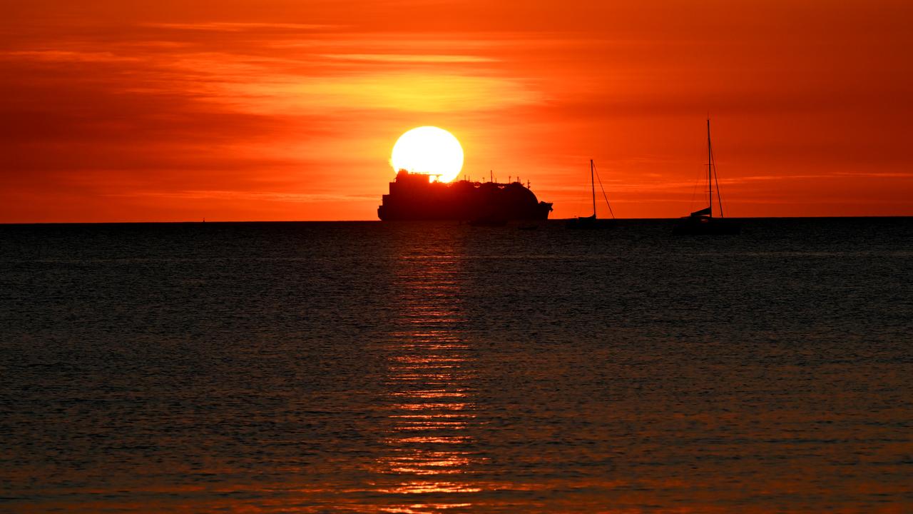 An LNG carrier ship is sailing out of Darwin Harbour