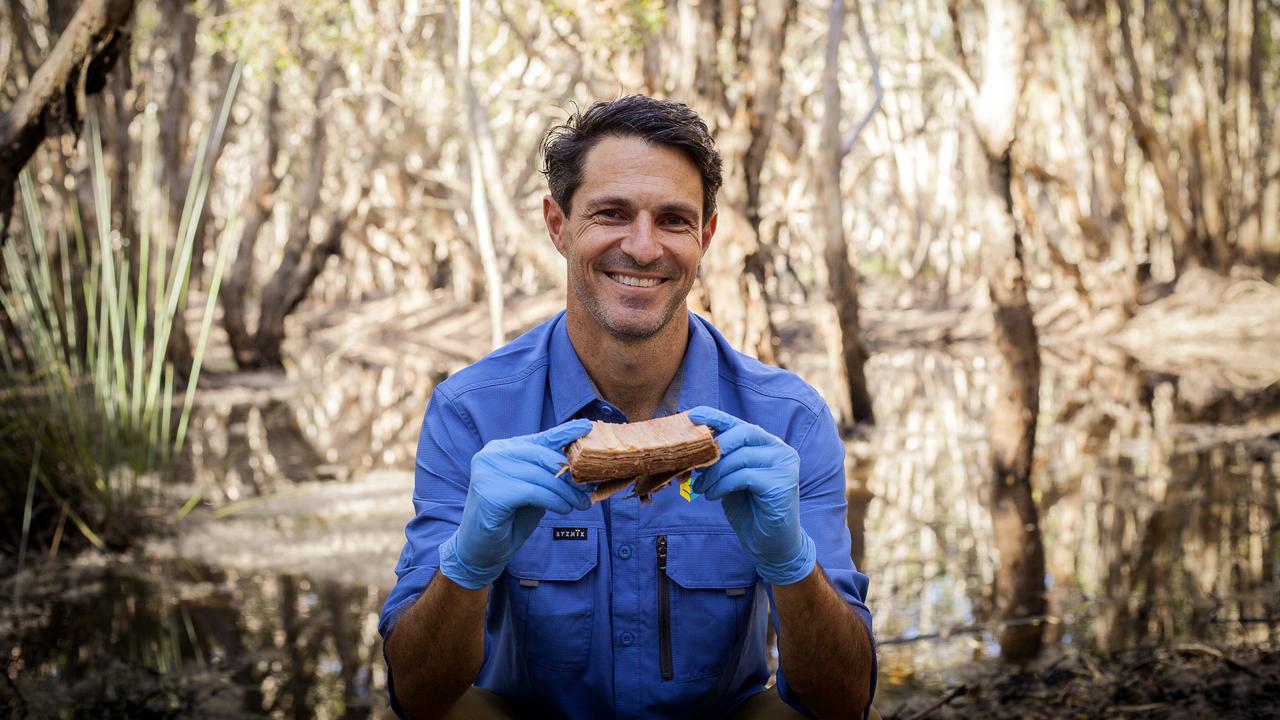 Luke Jeffrey holds bark cut-out