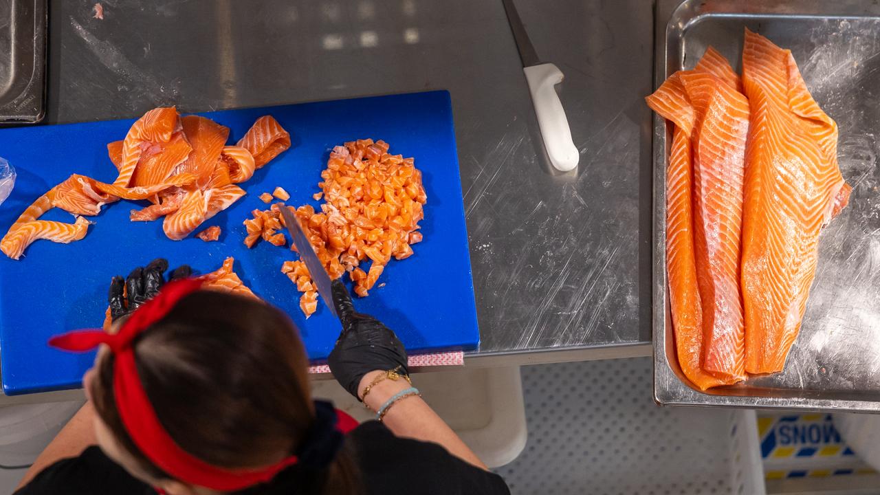 Salmon being chopped at the Sydney Fish Market