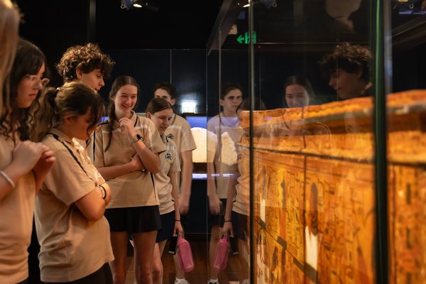 School students look at a museum display