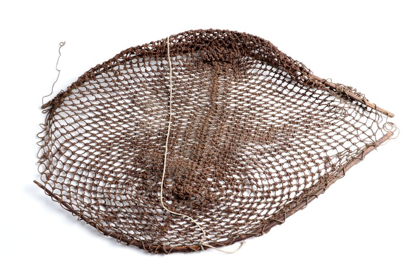 Woven fishing net with a wooden frame, dark brown fibre from Bentinck Island, Australia.