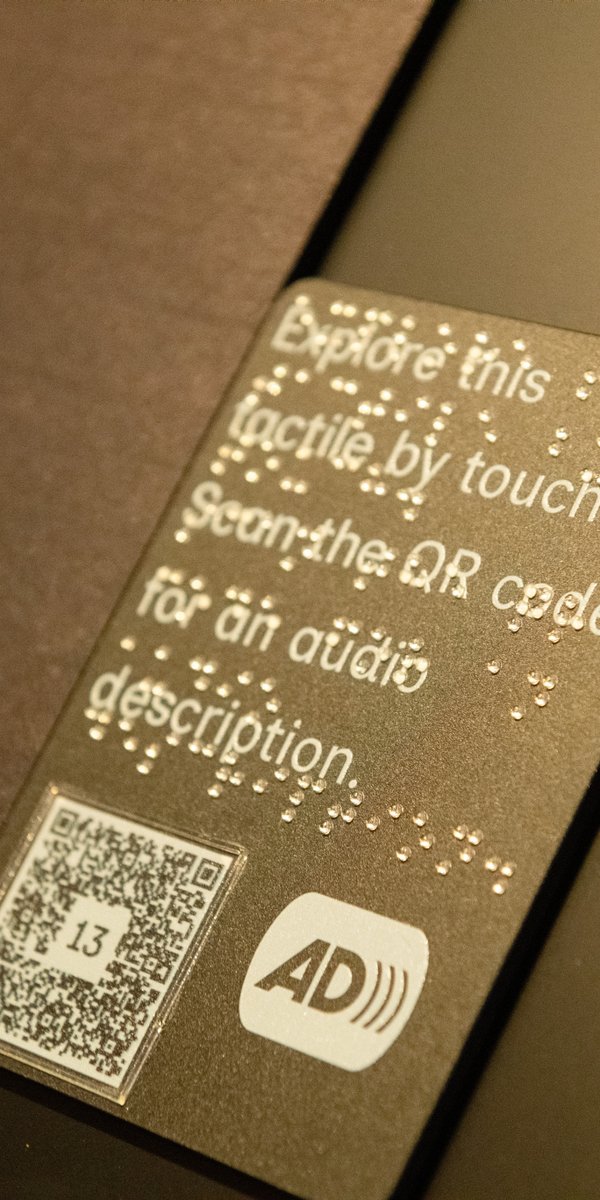 Each photograph in the  Unfinished Business exhibition has a tactile representation that visitors can touch accompanied by an audio description accessed via the QR code. Uncle John advised on the accessibility of the exhibition.