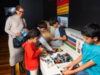 RELICS A New World Rises exhibition featuring the interactive build area. Discover LEGO® worlds thriving within treasured objects from the past.