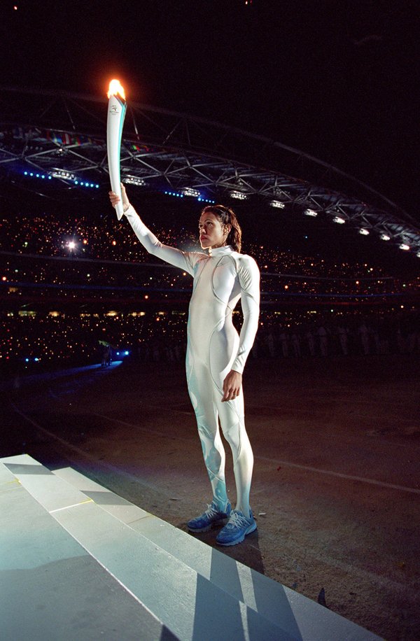 Cathy Freeman holding the Olympic torch