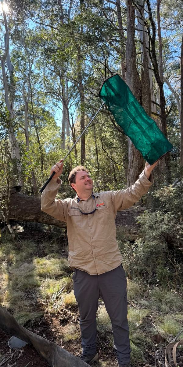 Dane Trembath with vertebrate trap (Ben Daly)