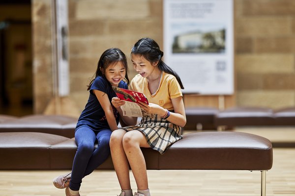 Children in Australian Museum Hintze Hall looking at map