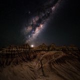 <i>2023 Australian Geographic Nature Photographer of the Year</i>
<p>
Winner Astrophotography: Mungo by Jason Perry, Victoria.
<p><i>Mungo is dominated by ancient lake beds that dried up close to 18,000 years ago. Wind and water have since created the crescent-shaped landforms called lunettes that you see in this image. The lunette is incredibly beautiful in daylight, but there is something special about seeing it under the light of the cosmos that made capturing this moment even more special. </i>