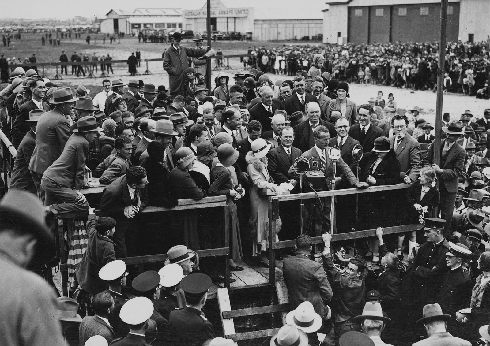 Kingsford Smith at the microphone