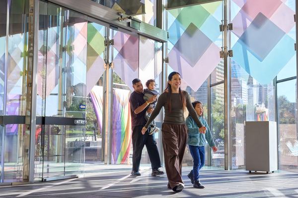 Family entering the Crystal Hall entrance of the Australian Museum