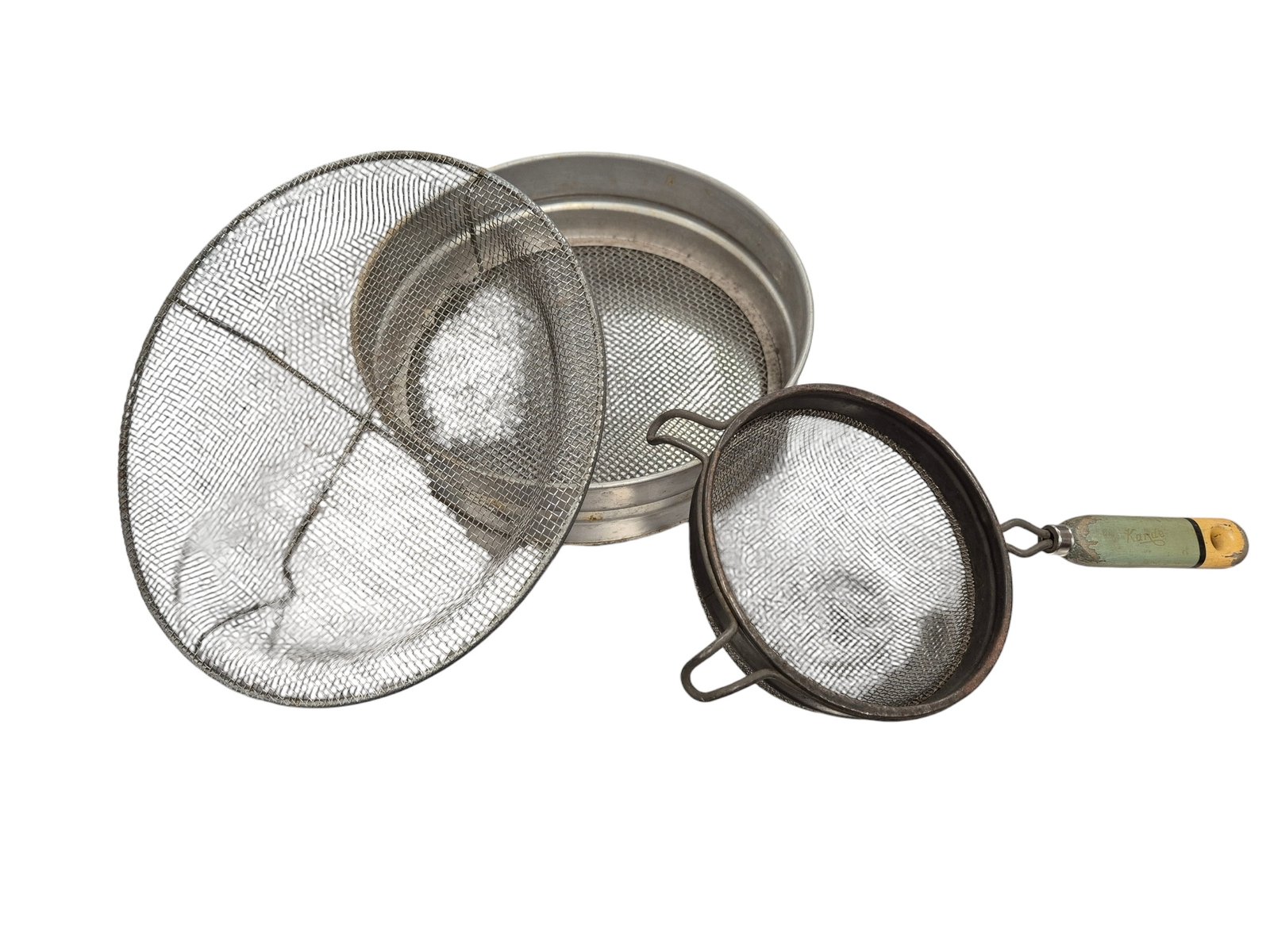 Three sieves, stacked on top of each other against a white background.