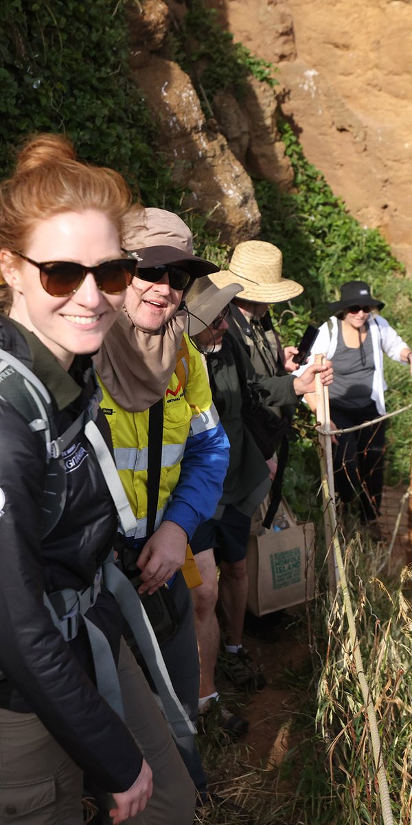 Rebecca Bray (Auckland Museum) and Dane Trembath (Australian Museum) scaling the steep landing site on Phillip Island.