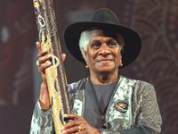 Evelyn Scott, holding a rain stick