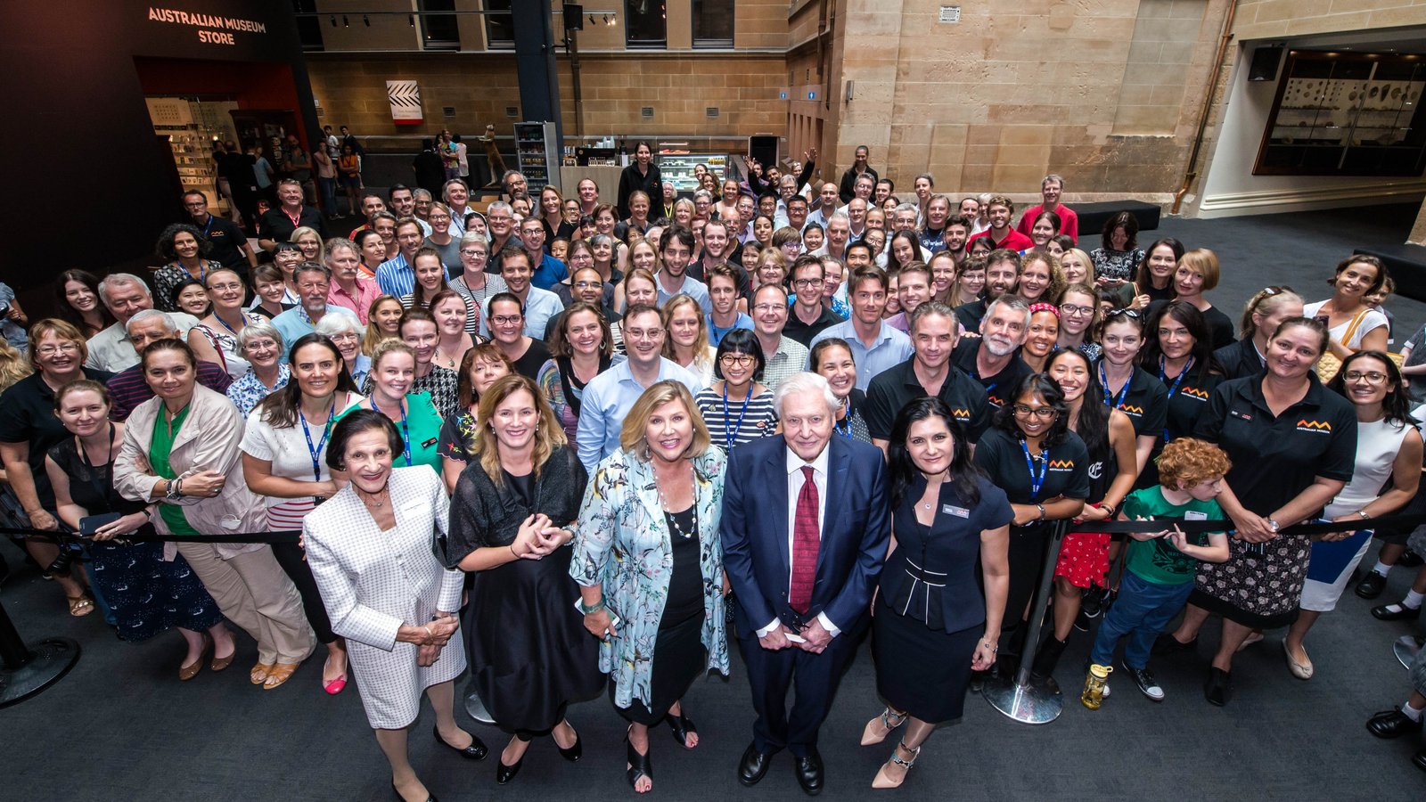 Sir David Attenborough with Australian Museum Director Kim McKay and staff for a group photo.