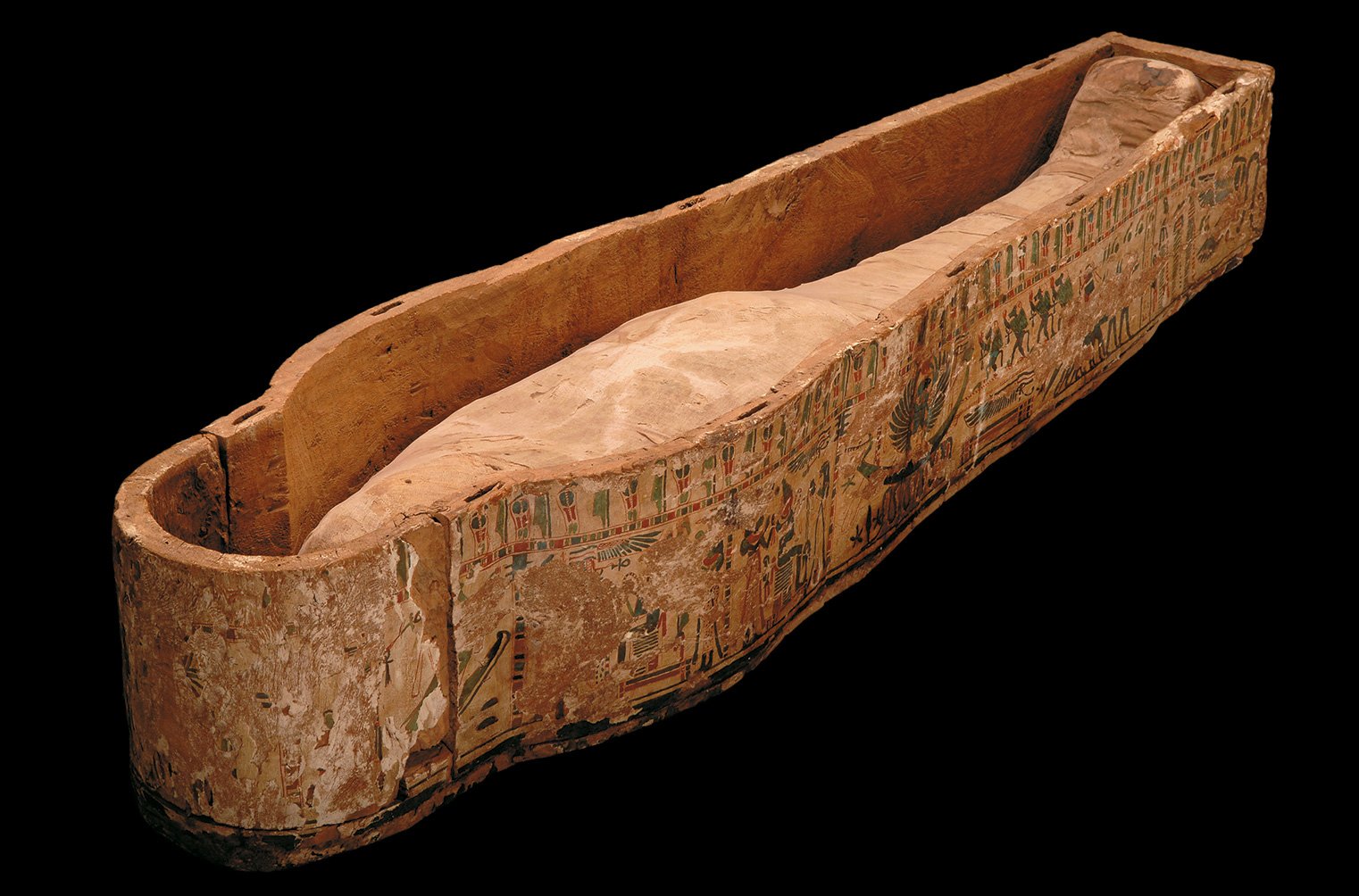 Ancient Egyptian coffin case from Thebes, decorated with hieroglyphs and figures of deities.