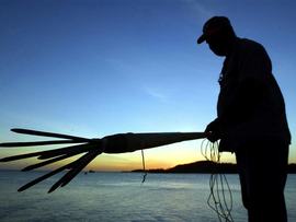 A man holds a traditional fishing spear (file image)