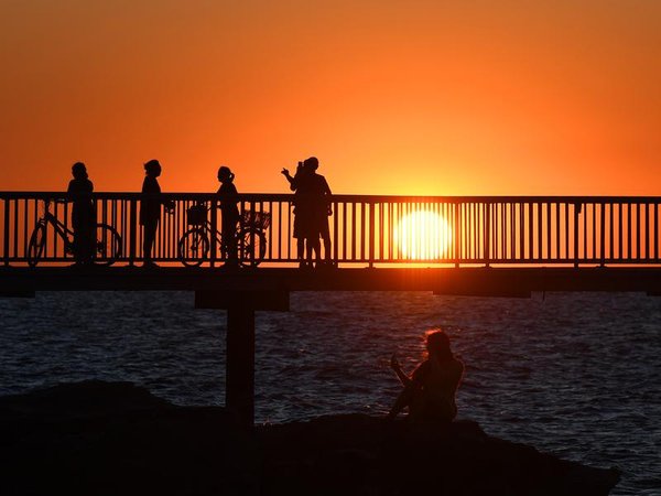 People watch the sunset in Darwin (file image)