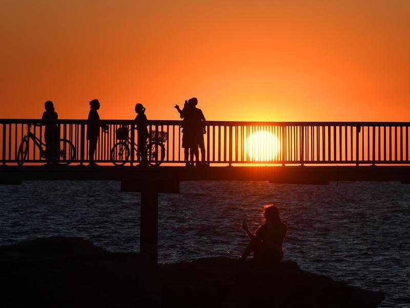 People watch the sunset in Darwin (file image)