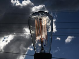 A light bulb and power lines (file image)