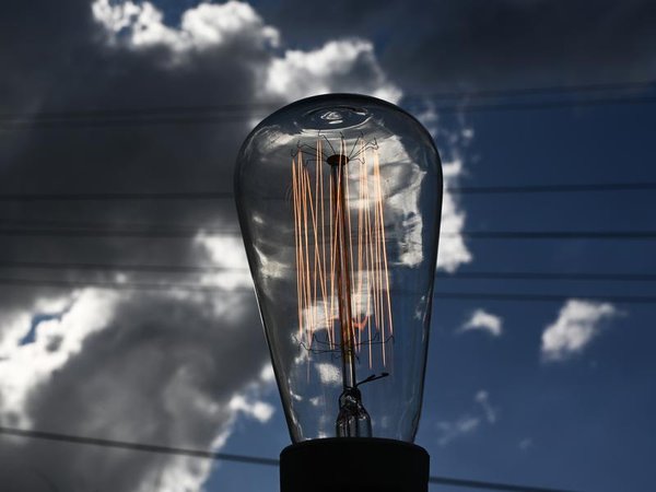A light bulb and power lines (file image)