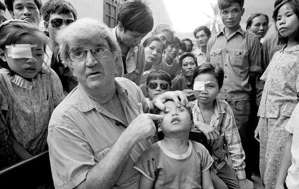 The iconic image of a young Tran Van Giap with Fred Hollows in Vietnam.