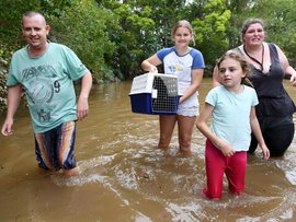 Residents in floodwaters in Lismore (file)