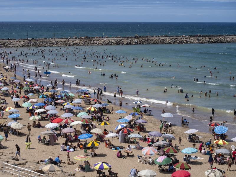People enjoy the beach in Morocco