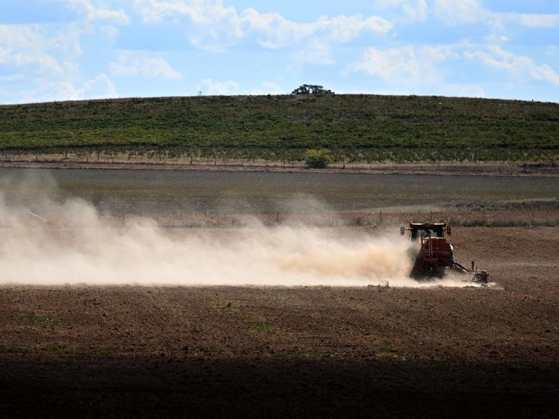 A farmer ploughs a field
