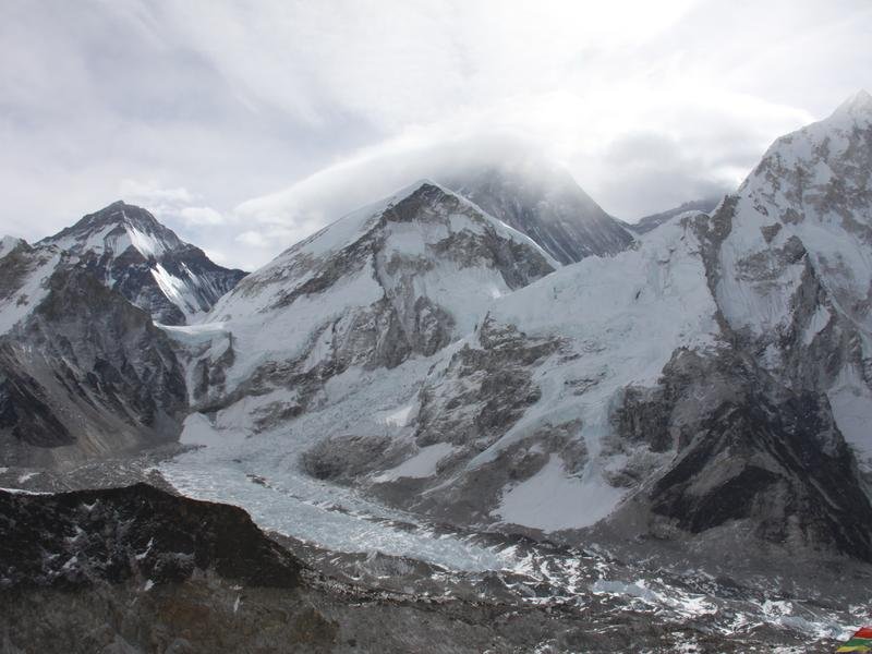The tip of Mount Everest hiding behind clouds (file image)