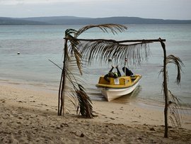A ferry operator takes a break on his boat in Vanuatu