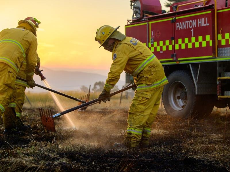 Firefighters extinguish a fire.